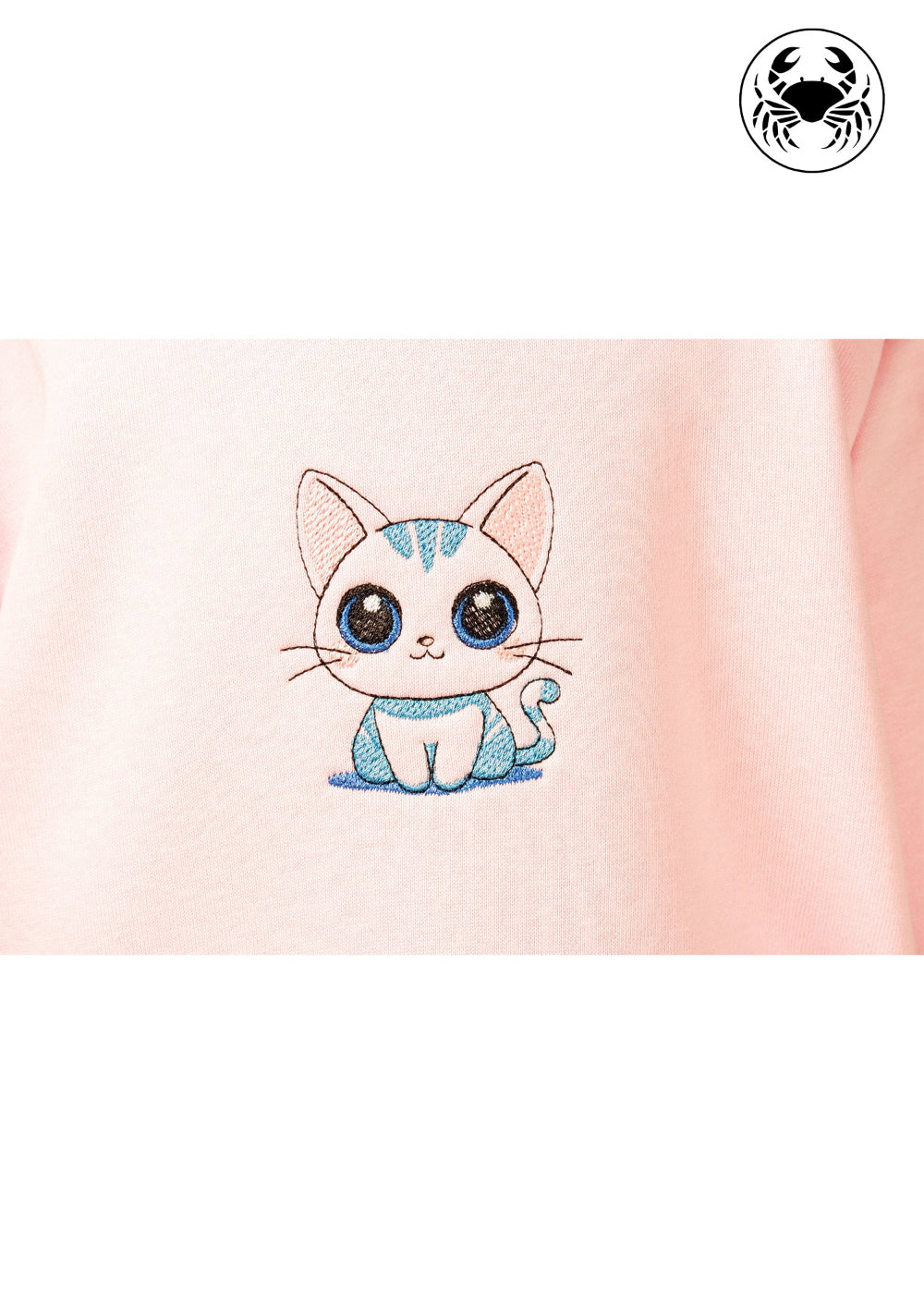 Close-up of embroidered cute kitty design on light pink kids hoodie, Canadian apparel