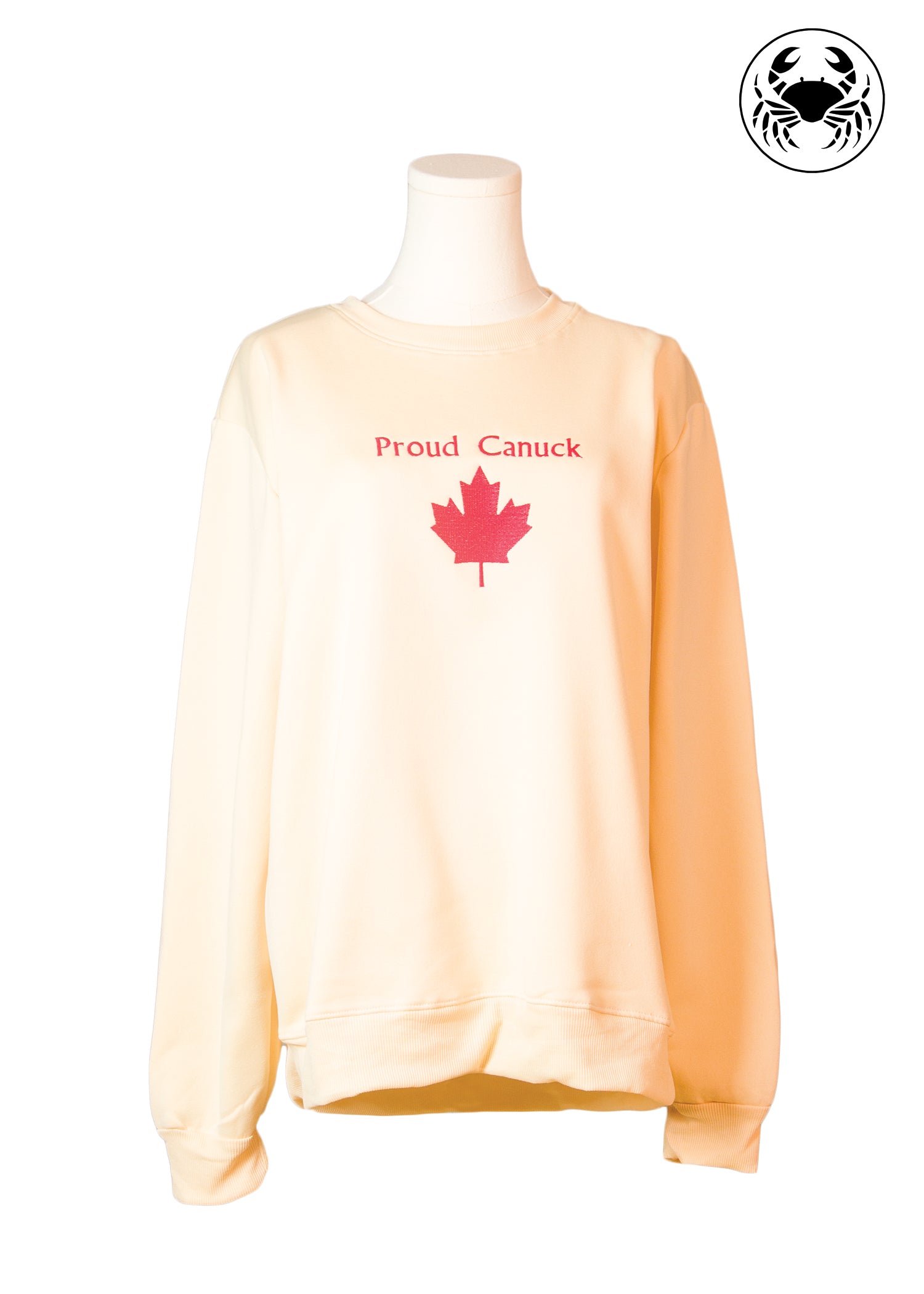 Front view of beige sweatshirt with red maple leaf and “Proud Canuck” embroidery, Canadian apparel