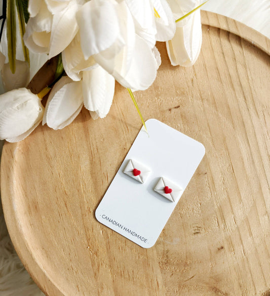 Handmade love letter stud earrings crafted from polymer clay, lightweight with hypoallergenic posts, perfect for Valentine's or everyday wear.